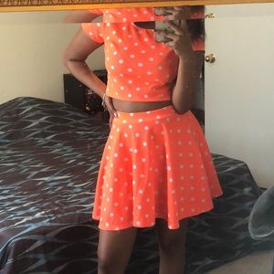 An orange and white polka dot two-piece.